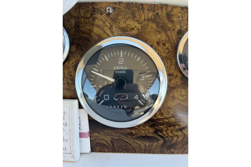 Slide: The Image of RPM gauge on 1997 Sea Ray 420 Aft Cabin boat dashboard. - 19