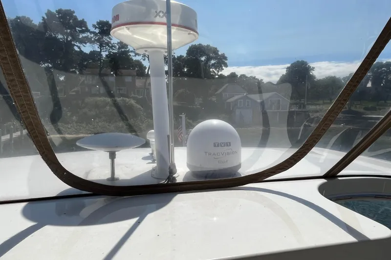 Slide: The Image of 1997 Sea Ray 420 Aft Cabin with TracVision satellite system on deck. - 21