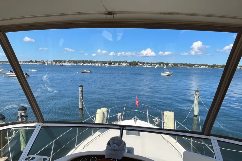 Slide: The Image of View from 1997 Sea Ray 420 Aft Cabin yacht, overlooking a serene marina. - 22