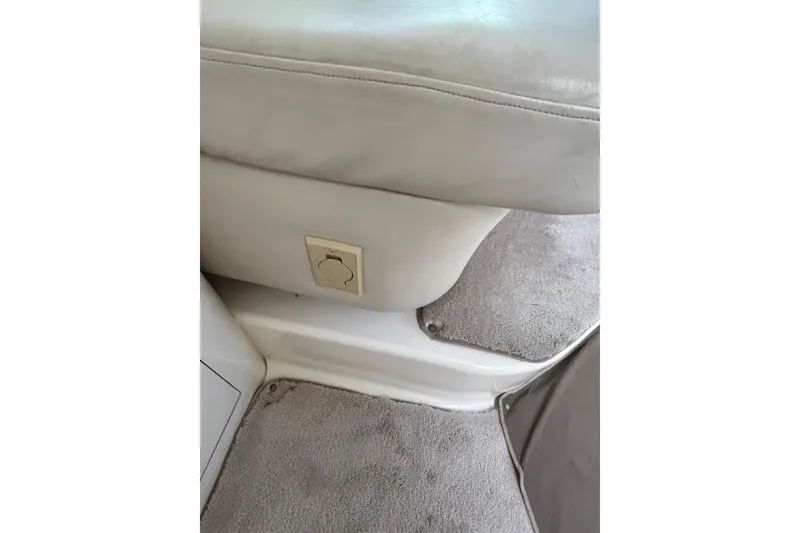 Slide: The Image of 1997 Sea Ray 420 Aft Cabin interior with beige upholstery and carpeted flooring. - 42