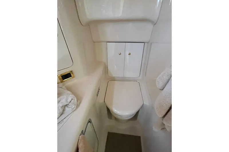 Slide: The Image of Bathroom interior of 1997 Sea Ray 420 Aft Cabin yacht, featuring compact design. - 48