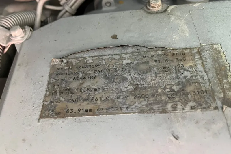 Slide: The Image of 1997 Sea Ray 420 Aft Cabin engine plate with specifications and serial numbers. - 56