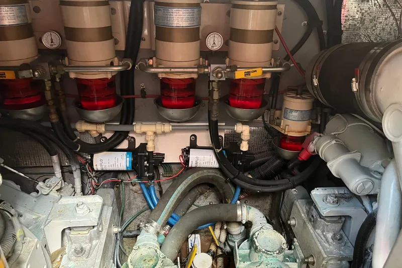 Slide: The Image of Engine room of 1997 Sea Ray 420 Aft Cabin with fuel filters and hoses. - 59