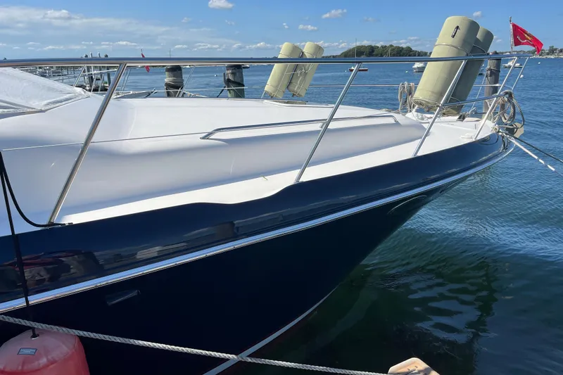 Slide: The Image of 1997 Sea Ray 420 Aft Cabin yacht docked on a sunny day. - 69