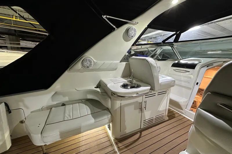 Slide: The Image of Interior of 1997 Sea Ray Sundancer 370 yacht with seating and sink area. - 12