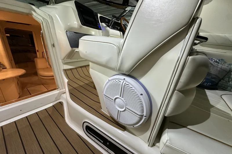 Slide: The Image of 1997 Sea Ray Sundancer 370 interior with speaker and seating area. - 14