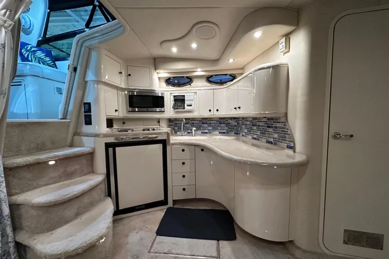 Slide: The Image of Luxurious 1997 Sea Ray Sundancer 370 yacht interior with modern kitchen and elegant design. - 19