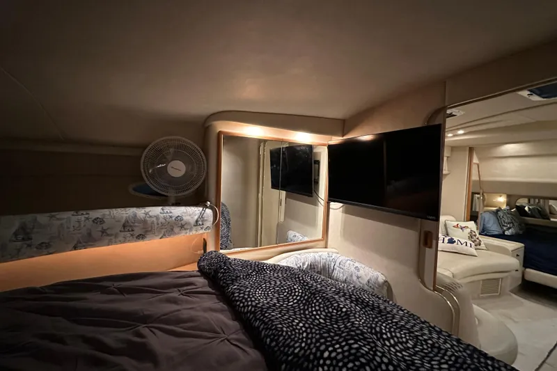 Slide: The Image of Interior of a 1997 Sea Ray Sundancer 370 yacht with cozy sleeping area and modern amenities. - 24