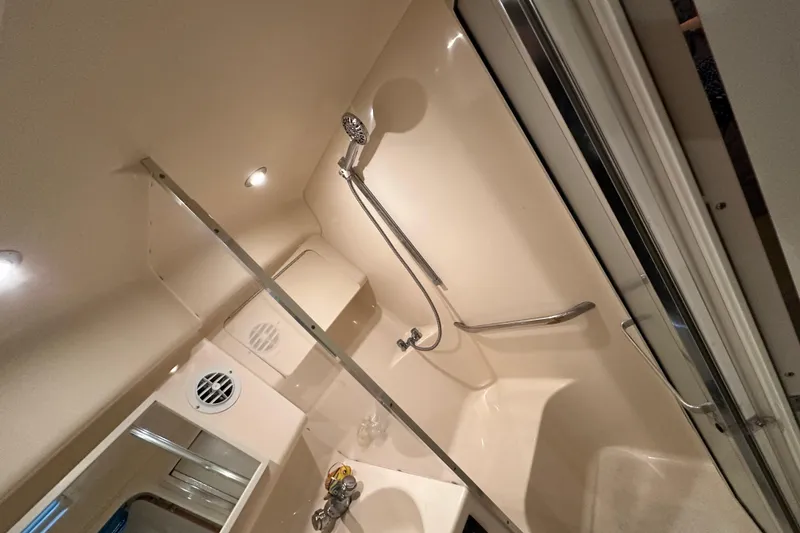 Slide: The Image of Bathroom interior of 1997 Sea Ray Sundancer 370 yacht, featuring shower and sink. - 28
