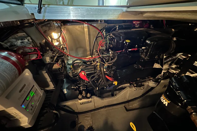Slide: The Image of Engine compartment of a 1997 Sea Ray Sundancer 370 with visible wiring and components. - 29