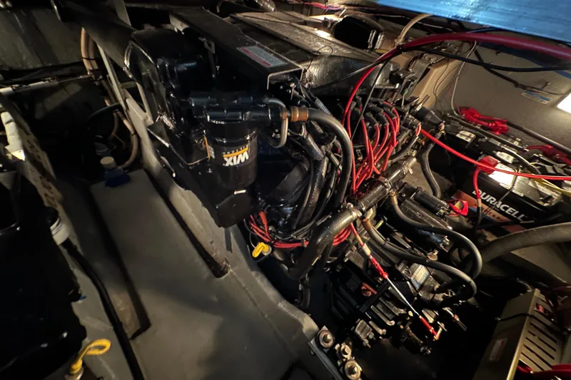 Slide: The Image of Engine compartment of a 1997 Sea Ray Sundancer 370 with visible wiring and components. - 30