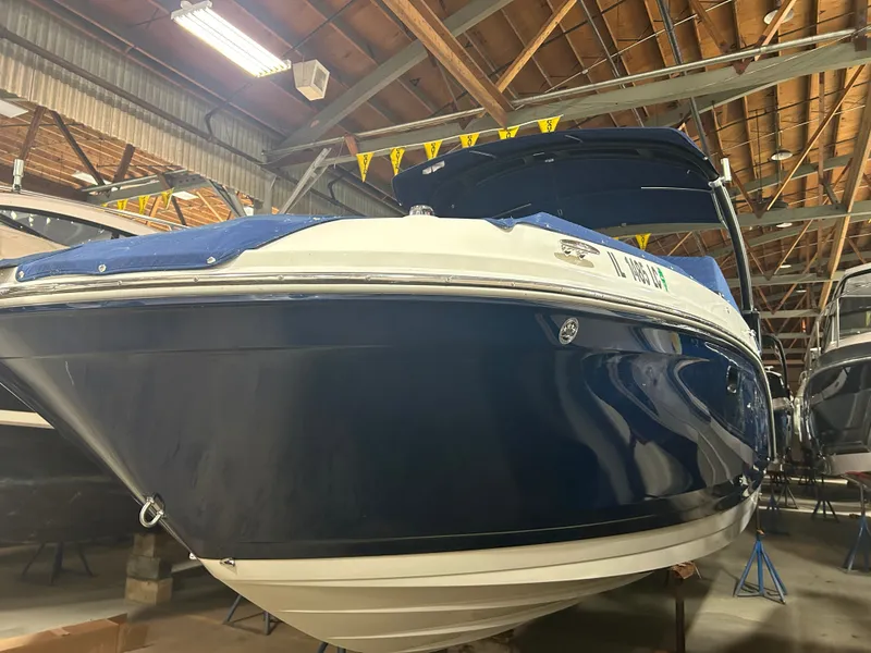 Slide: The Image of 2021 Sea Ray SDX 270 boat displayed in warehouse. - 11