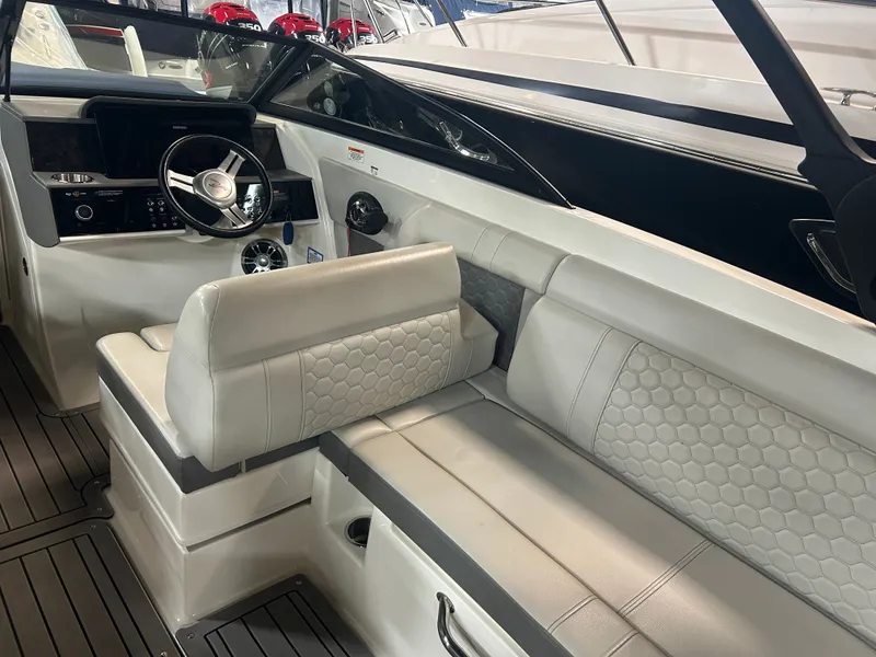 Slide: The Image of Interior of 2021 Sea Ray SDX 270 with steering wheel and seating. - 16