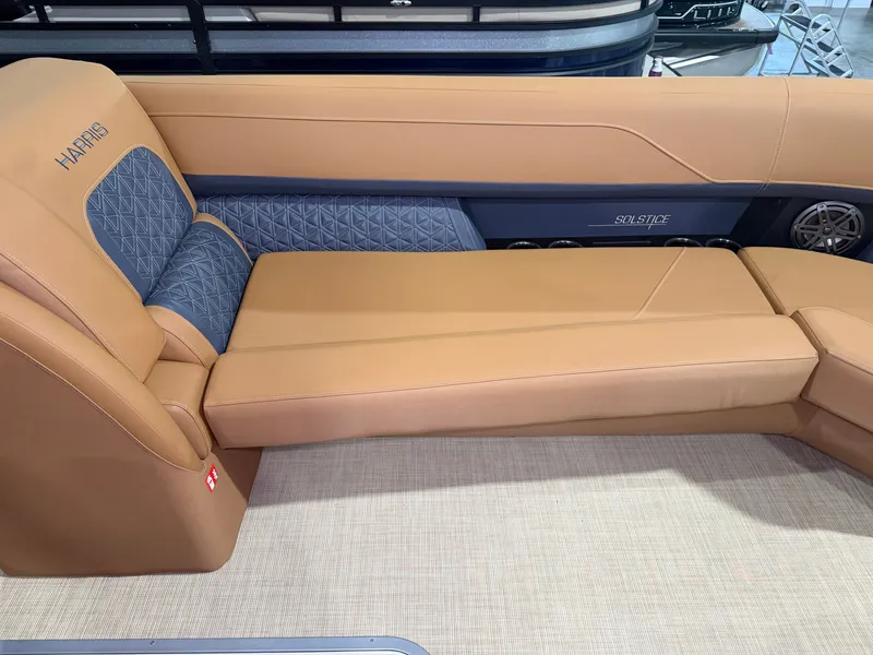 Slide: The Image of The image shows a luxurious lounging area on a Harris Solstice 250 boat. - 21