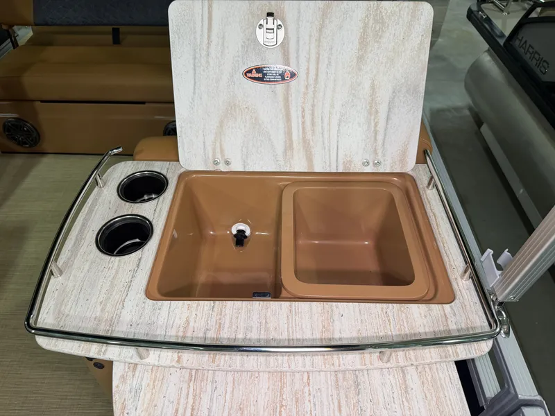 Slide: The Image of A sleek sink with dual basins and two cup holders on a boat. - 29