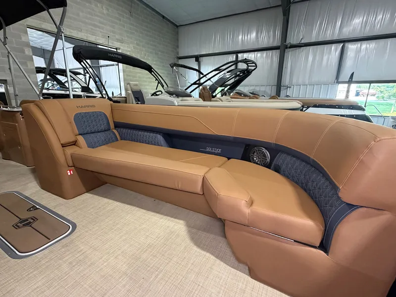 Slide: The Image of The image shows the interior of a 2026 Harris Solstice 250 with elegant leather seating. - 18