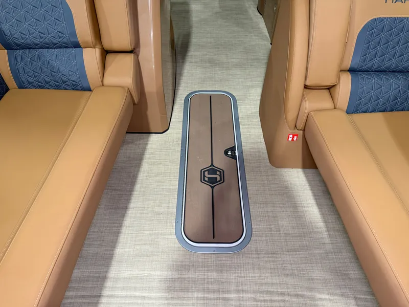 Slide: The Image of Interior of the Harris Solstice 250 with beige and blue seating and a floor compartment. - 24
