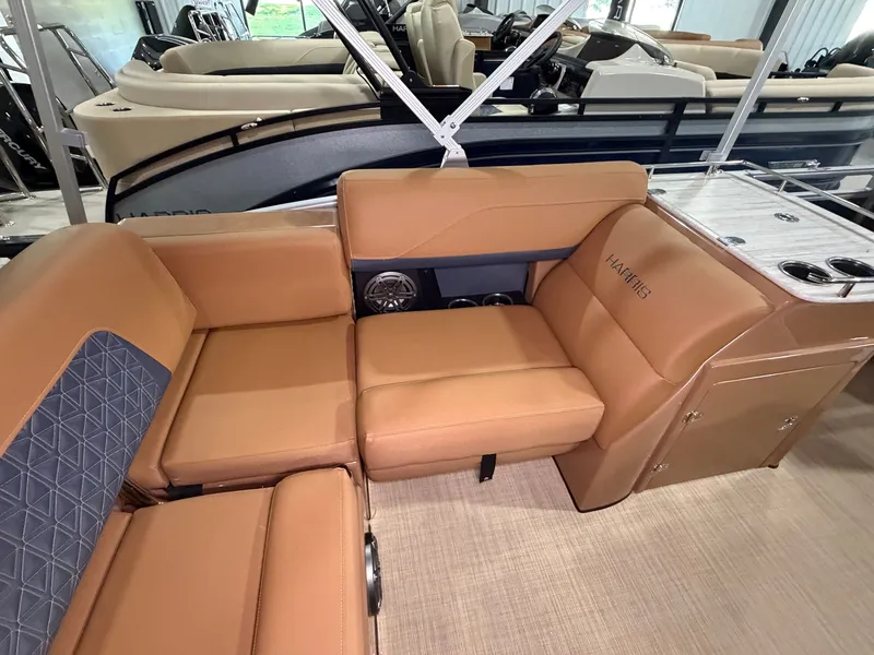 Slide: The Image of Interior of a 2026 Harris Solstice 250 with beige leather seating and a table. - 47
