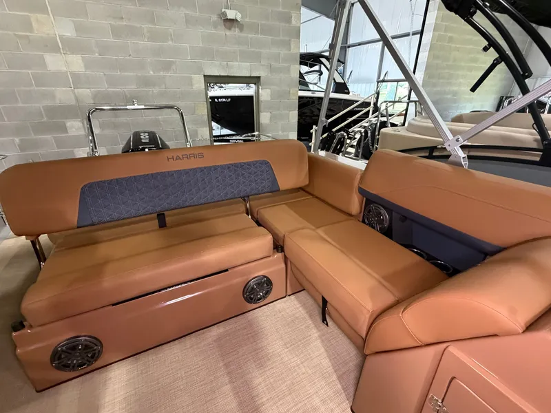 Slide: The Image of The image shows the interior of a 2026 Harris Solstice 250 with brown leather seating. - 46