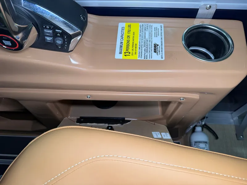 Slide: The Image of Close-up of a boat console with a cup holder and capacity label. - 43