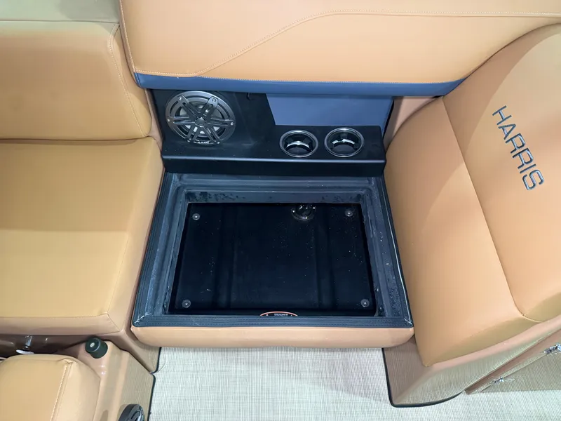 Slide: The Image of The image shows the interior of a 2026 Harris Solstice 250 with beige seating and speakers. - 48