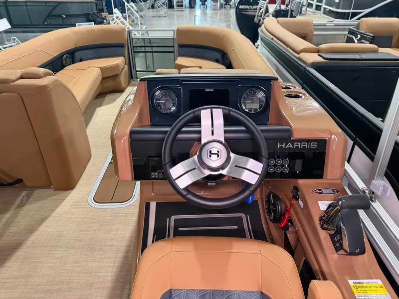 Slide: The Image of The image shows the cockpit of a 2026 Harris Solstice 250 with a modern steering wheel and instruments. - 36