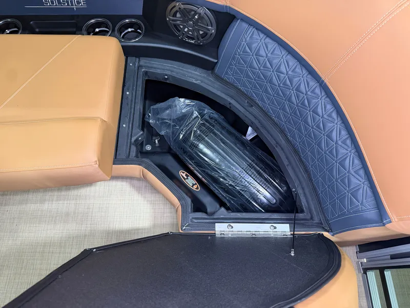 Slide: The Image of Interior of a Harris Solstice 250 with brown and blue upholstery and speakers. - 20
