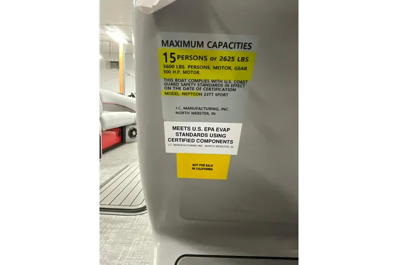 Slide: The Image of 2026 JC NEPTOON SPORT 21TT boat capacity label, 15 persons or 2625 lbs, safety standards. - 15