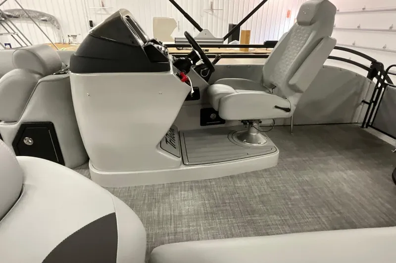 Slide: The Image of Interior of 2026 JC NEPTOON SPORT 21TT boat, featuring sleek helm and seating. - 5