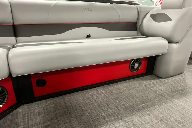 Slide: The Image of 2026 JC NEPTOON SPORT 21TT boat interior with gray seating and red accents. - 21