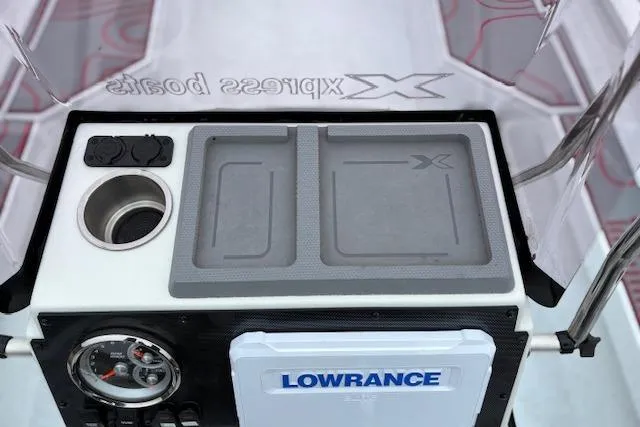 Slide: The Image of 2024 Express H22B boat console with Lowrance system and cup holder. - 19