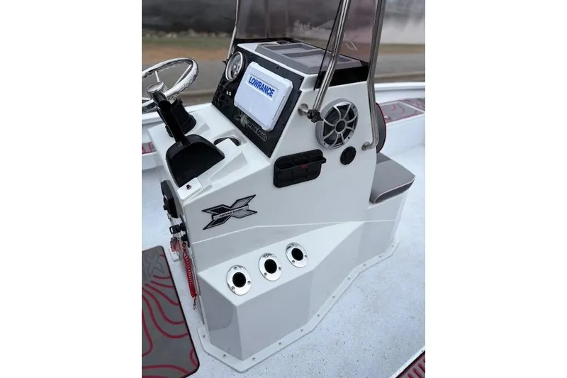 Slide: The Image of 2024 Express H22B boat console with steering wheel, Lowrance display, and control panel. - 20