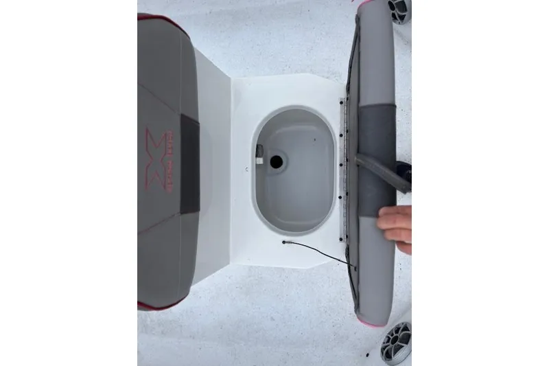 Slide: The Image of 2024 Express H22B boat interior with storage compartment and seating. - 22