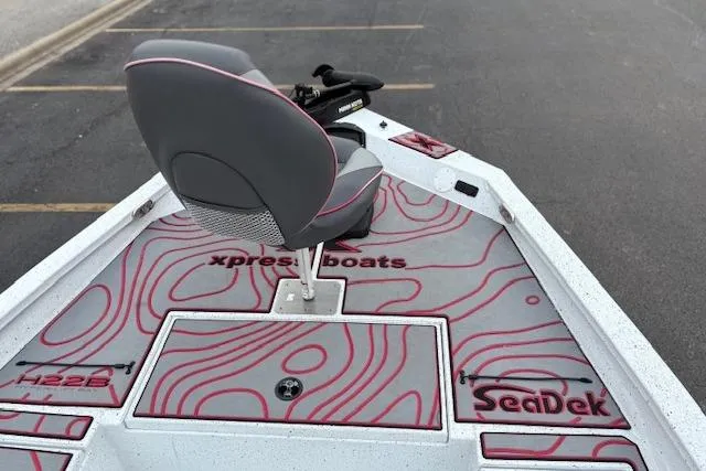 Slide: The Image of 2024 Express H22B boat interior with SeaDek flooring and swivel seat. - 23