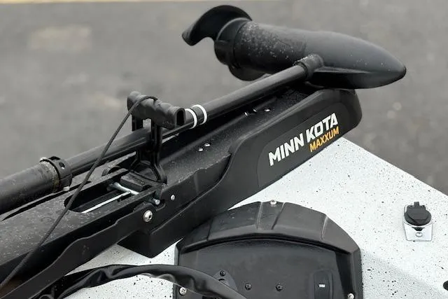 Slide: The Image of Minn Kota Maxxum trolling motor on 2024 Express H22B boat deck. - 29