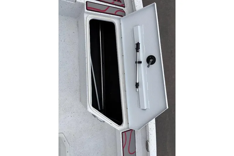 Slide: The Image of Open storage compartment in 2024 Express H22B boat, featuring a sleek white interior design. - 30