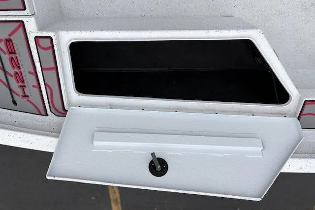 Slide: The Image of 2024 Express H22B storage compartment with open hatch, showcasing interior space. - 31