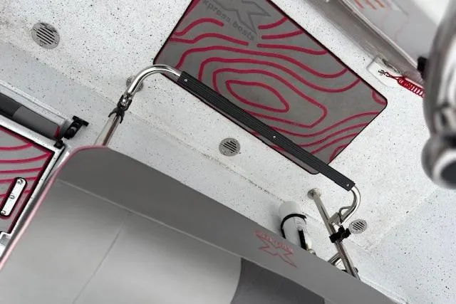 Slide: The Image of 2024 Express H22B interior with modern design and red accents, featuring sleek equipment. - 35