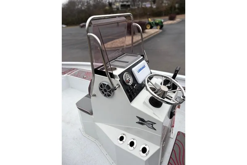 Slide: The Image of 2024 Express H22B boat console with steering wheel and navigation system. - 41