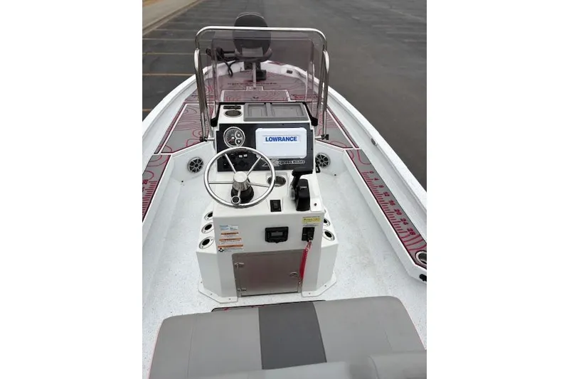 Slide: The Image of 2024 Express H22B boat console with steering wheel and Lowrance display. - 43