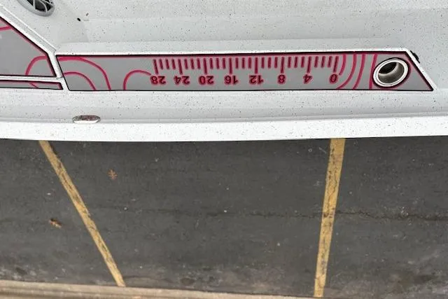 Slide: The Image of 2024 Express H22B boat with measurement scale detail on the side. - 44