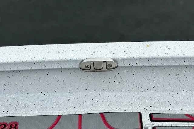 Slide: The Image of 2024 Express H22B boat detail with speckled finish and metal fitting. - 46