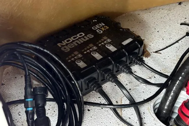 Slide: The Image of Noco Genius GEN5X3 battery charger with cables, Express H22B 2024 model. - 49