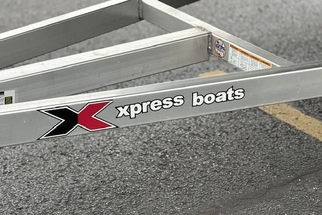 Slide: The Image of 2024 Express H22B boat trailer with "Xpress Boats" logo on metal frame. - 56