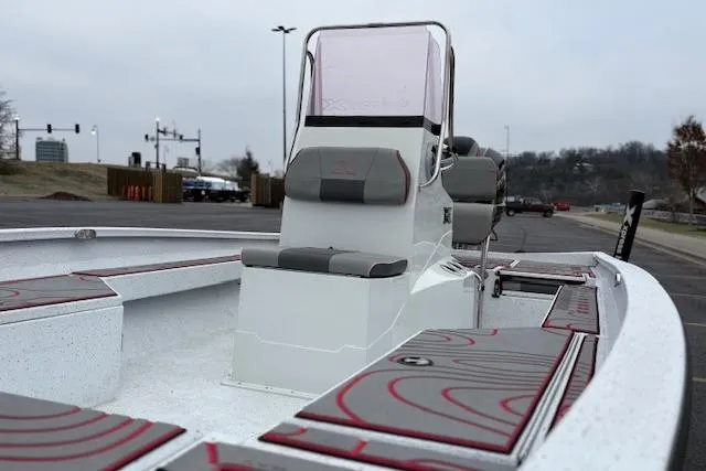 Slide: The Image of 2024 Express H22B boat with sleek design, featuring comfortable seating and modern console. - 58