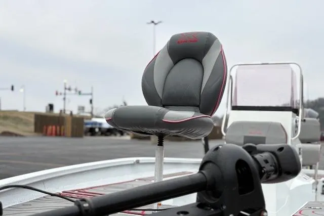 Slide: The Image of 2024 Express H22B boat seat and console in a parking lot setting. - 67
