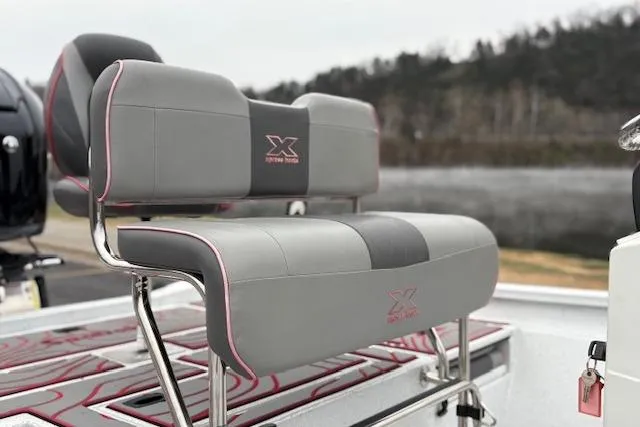 Slide: The Image of 2024 Express H22B boat seat with gray and pink accents, featuring stylish design. - 69