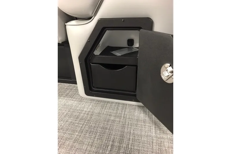 Slide: The Image of 2026 JC NEPTOON SPORT 21TT storage compartment with open door, showcasing interior space. - 19