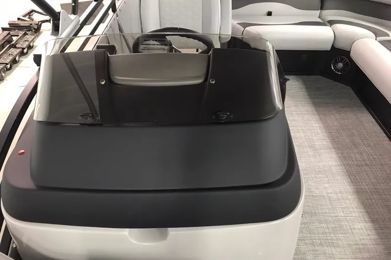 Slide: The Image of 2026 JC NEPTOON SPORT 21TT boat interior with sleek dashboard and seating. - 23