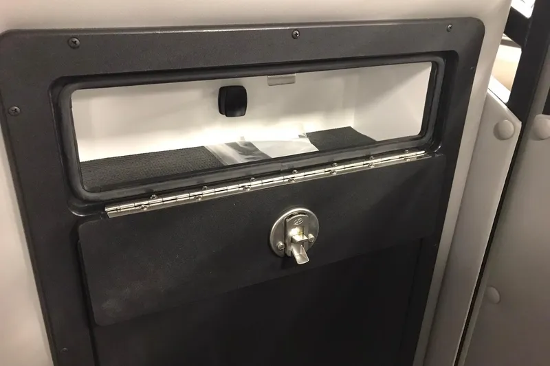 Slide: The Image of Storage compartment with lock on 2026 JC NEPTOON SPORT 21TT boat. - 28